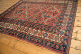 Vintage Kurdish carpet border with geometric design in madder red, navy, and saffron.