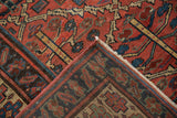 Vintage Kurdish square carpet corner revealing madder red pile, geometric pattern, and foundation wear.