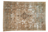 Decorative distressed Kerman carpet with faded European floral vinery, central medallion, and soft beige, blue tones.
