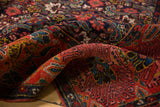 Dense pile of antique Persian Bijar rug with Herati and garden motifs, ruby, navy.