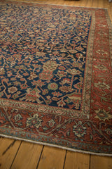 Madder root red border with powder blue patterns and secured fringe on the vintage Heriz rug.