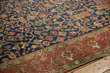 Intricate vine and floral patterns on the navy blue field and madder red border of the vintage Heriz.