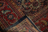 Vintage Persian Mahal corner showing wear, red and navy trellis pattern with detailed border.