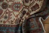 Draped view of a vintage Hamadan rug showing its time-softened pile and floral pattern.