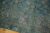 Distressed sapphire blue and wine red Herati pattern on a vintage Tabriz carpet.