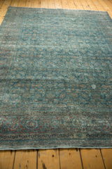 Distressed vintage Persian Tabriz carpet with sapphire blue Herati motif and faded red accents.