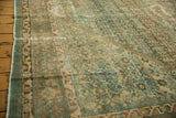 Distressed Malayer carpet texture with dusty teal and beige Herati motifs, revealing faint foundation wear.