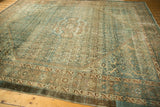 Distressed Malayer rug, showing worn pile with faint foundation and dusty teal hues.