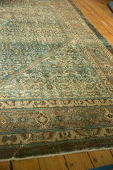 Distressed Malayer rug corner, even pile wear, Herati field, in muted green-blue and beige.