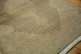 Faded Herati motif, even wear on vintage distressed Tabriz rug in coffee and sand.