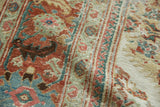 Worn pile and foundation of a distressed Sultanabad rug, terracotta and sky blue Herati motifs.