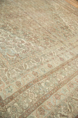 Distressed Bibikabad carpet showing muted beige, sand, and blush Herati pattern and soft wear.