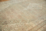 Hand-knotted vintage Bibikabad carpet texture, displaying worn Herati motifs in time-softened tones.