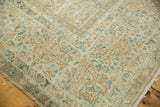 Textural pile of the distressed Kerman carpet with delicate ivory and sky blue blossoms.
