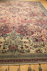 Detailed floral border and expertly secured fringe on an antique Persian Kerman rug.