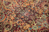 Intricate antique Kerman carpet design: sprawling floral palmettes in cochineal red, powder blue.