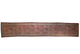 Vintage Persian Malayer runner with a repeating boteh pattern in distressed copper red, ivory, and powder blue.