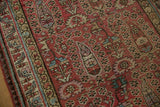 Evenly worn pile showing the knot heads and boteh motifs of a vintage Malayer rug.