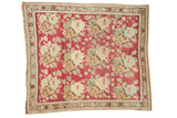 Antique Karabagh square rug: raspberry red abrashed field, ivory rose bouquet, starburst border.