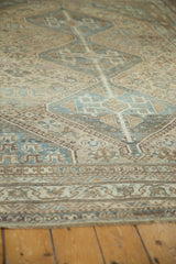 Distressed vintage Kamseh carpet, faded slate blue and coffee geometric motifs.