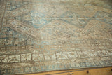 Distressed vintage Kamseh tribal rug, showing even wear in beige, sand, and slate blue tones.