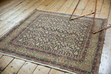 Distressed Sparta rug corner, showing blush pink turtle design border and wear.
