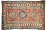 Vintage distressed Caucasian rug, triple geometric medallions in faded red, blue, and oxidized green.