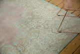 Faded Mil Fleur motif and Rococo relief on distressed Kerman carpet corner.