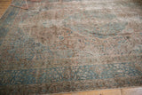 Distressed pile texture of a Vintage Tabriz rug, revealing faded blue vinery and ivory tones.