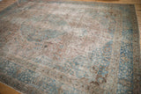 Distressed vintage Tabriz carpet: intricate scrolling vinery in soft blue and antique ivory.