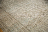 Distressed Meshed carpet detail, worn texture with muted silver, seafoam, and ivory tones.