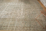 Distressed vintage Persian Meshed carpet, showing softened oxidized silver and seafoam vinery.
