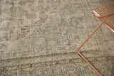 Distressed Meshed carpet with worn floral pattern and muted silver, ivory, seafoam tones.