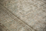 Textured distressed Meshed carpet, faded antique ivory, dusty seafoam, and charcoal patterns.