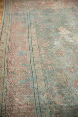 Distressed vintage Tabriz rug border, showing intricate faded raspberry and powder blue vinery.