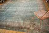 Textured wear revealing faint floral vinery motifs in powder blue, dusty raspberry, and cochineal red.