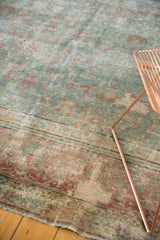 Distressed vintage Tabriz rug with faint floral vinery, powder blue, raspberry, and foundation lines.