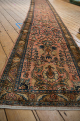 A view down the length of the Lilihan runner, showcasing its elongated floral vinery pattern.