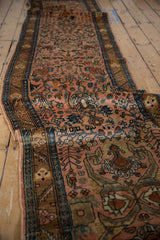 The vintage Lilihan runner's floral pattern extends down its full, gently waving length.