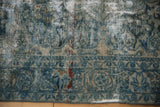 Distressed Lilihan rug's decorative worn field, highlighting teal floral motifs and exposed ivory foundation.