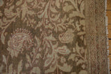Corner detail of the distressed vintage Malayer showing the border pattern and secured side fringe.