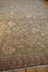 Angled view across the vintage Malayer carpet highlighting the texture of its evenly worn pile.