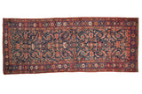 Antique Kurdish Bijar runner fragment, dense Herati motif in navy, madder red, and sapphire blue.