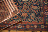Antique Kurdish Bijar runner with dense Herati field and intricate floral red border.