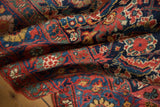 Antique Kurdish Bijar rug pile, dense Herati motif with madder red and navy hues.