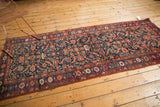 Intricate Herati motif on an antique Persian Kurdish Bijar runner with varied jewel tones.