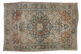 Distressed antique Farahan Sarouk rug, dramatic medallion in dusty teal, terracotta, ivory.