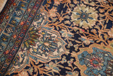 Detail of a Vintage Bibikabad carpet's intricate border and navy field floral pattern.