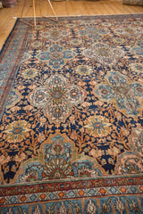 Bibikabad rug's intricate quatrefoil floral outlines with navy, madder red, and sky blue.