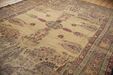 Corner of antique Kermanshah rug, with raspberry millefleur spandrel and storied paisley border.